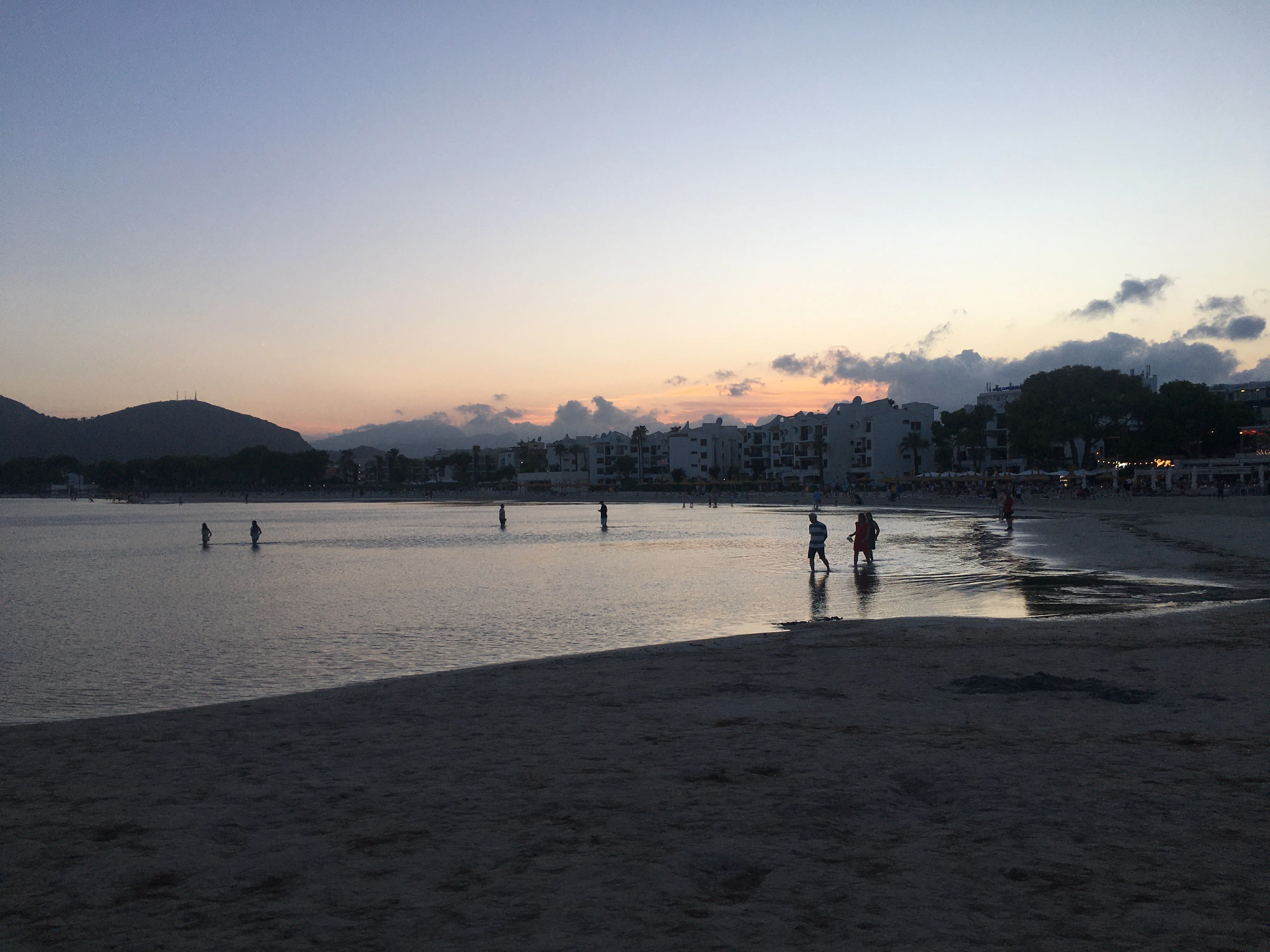 Aerial view of Alcudia old town with medieval walls and the Bay of Alcudia beyond