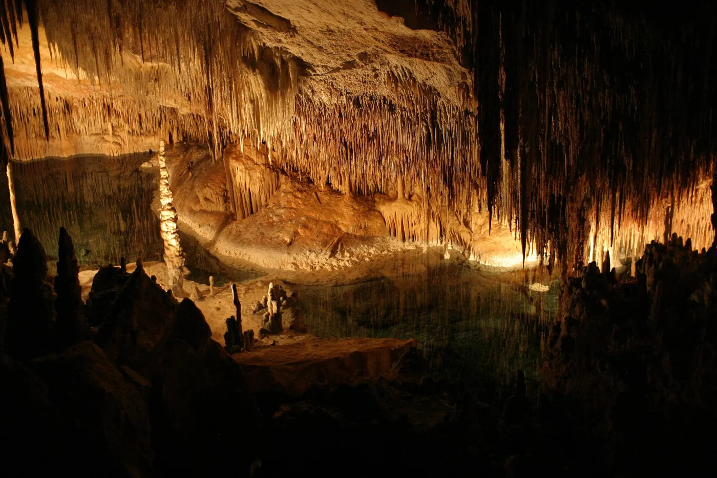 Underground lake and stalactites inside the Drach Caves in Porto Cristo
